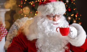 Santa drinking hot drink